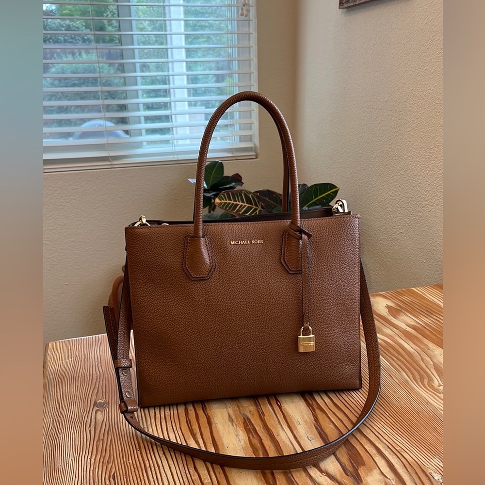 Michael Kors cross body bag, or handheld straps. Camel colored leather.